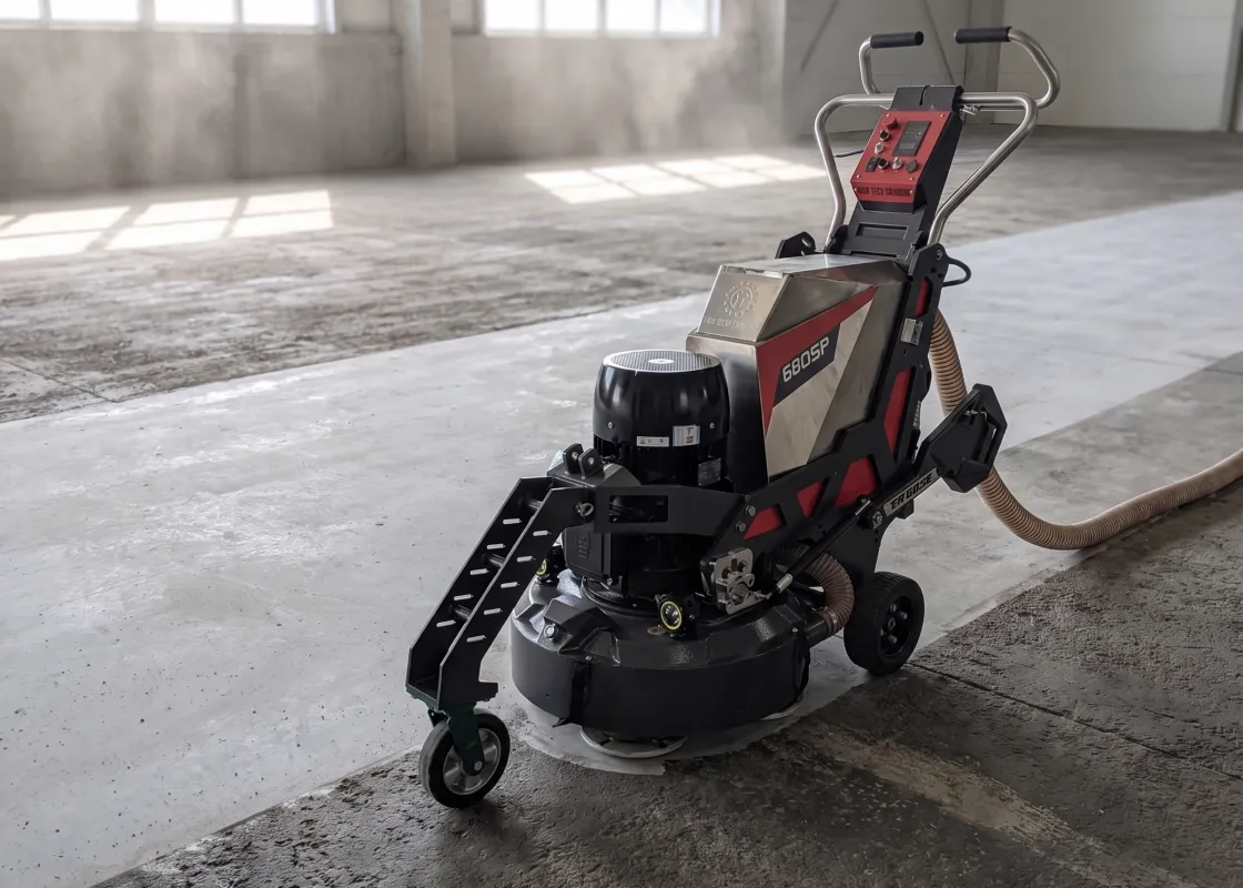 Floor grinder working on a concrete slab